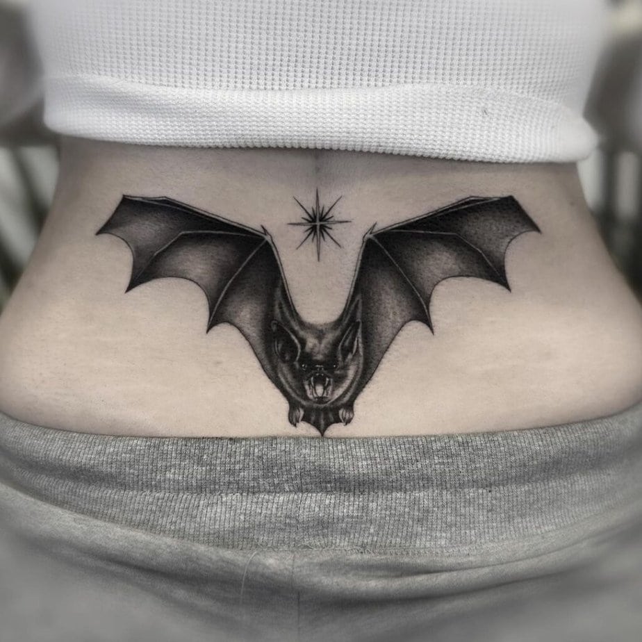 1. Gothic lower back tattoos for women