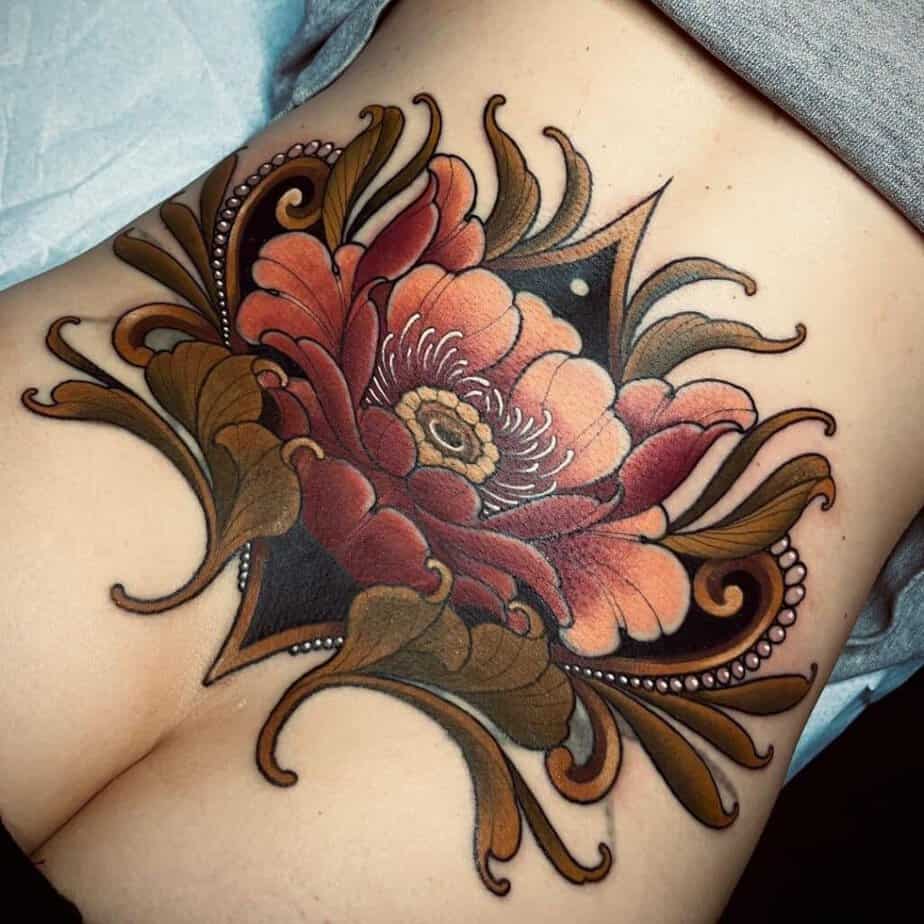 10. Colorful lower back tattoo