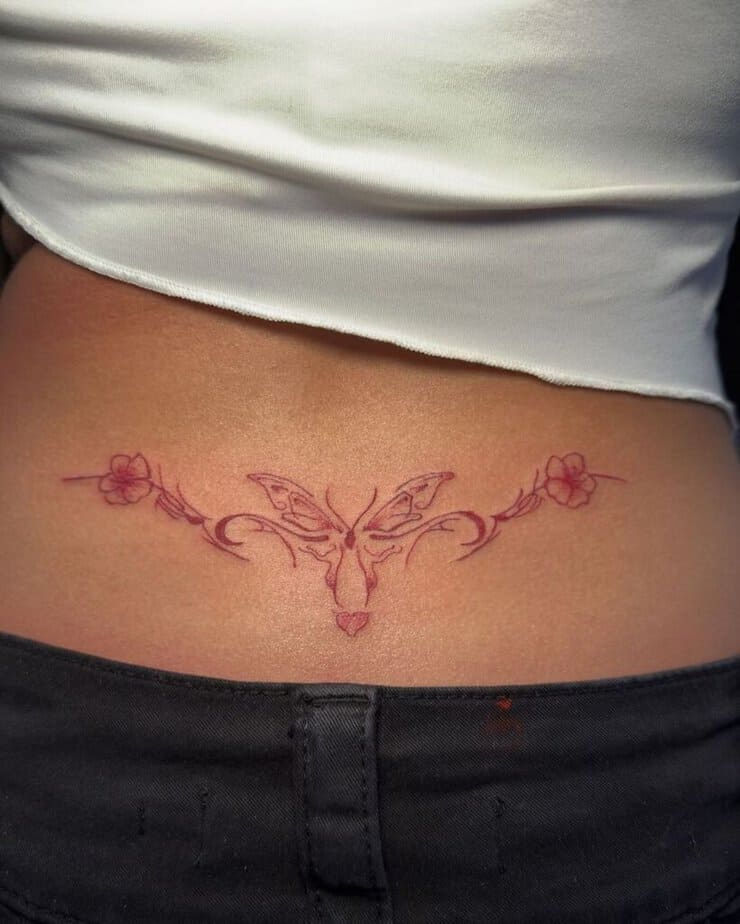 7. Butterfly lower back tattoo