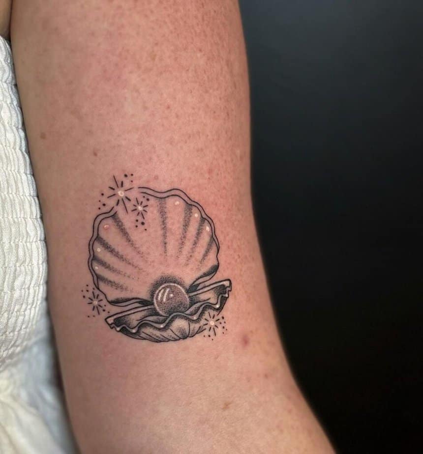 14. A pretty pearl & shell tattoo