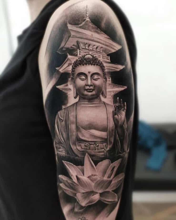 16. A black and grey Buddha