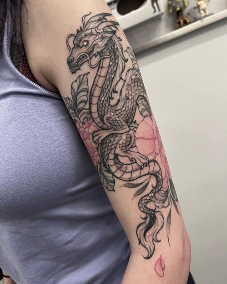 19. Detailed dragon tattoo for women