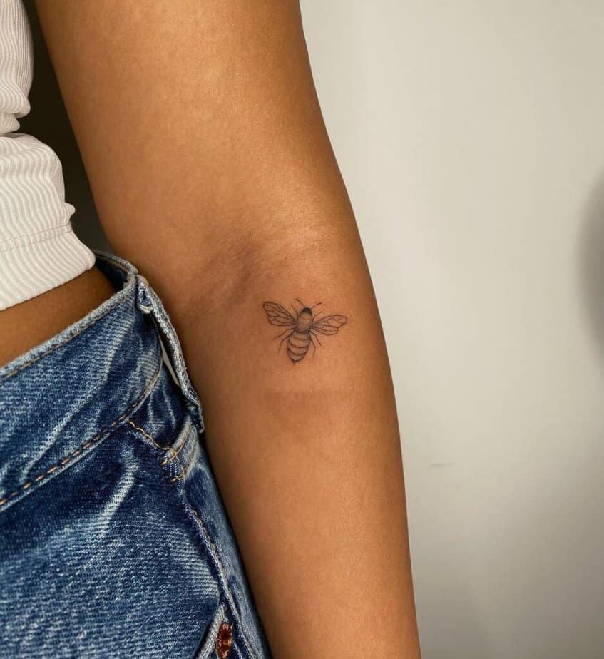 1. A stick-and-poke bee tattoo 