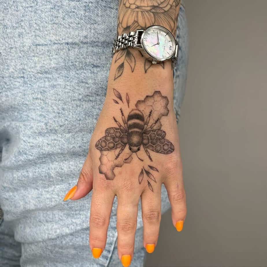 12. A bee tattoo on the hand