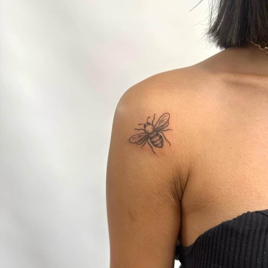 13. A bee tattoo on the shoulder 