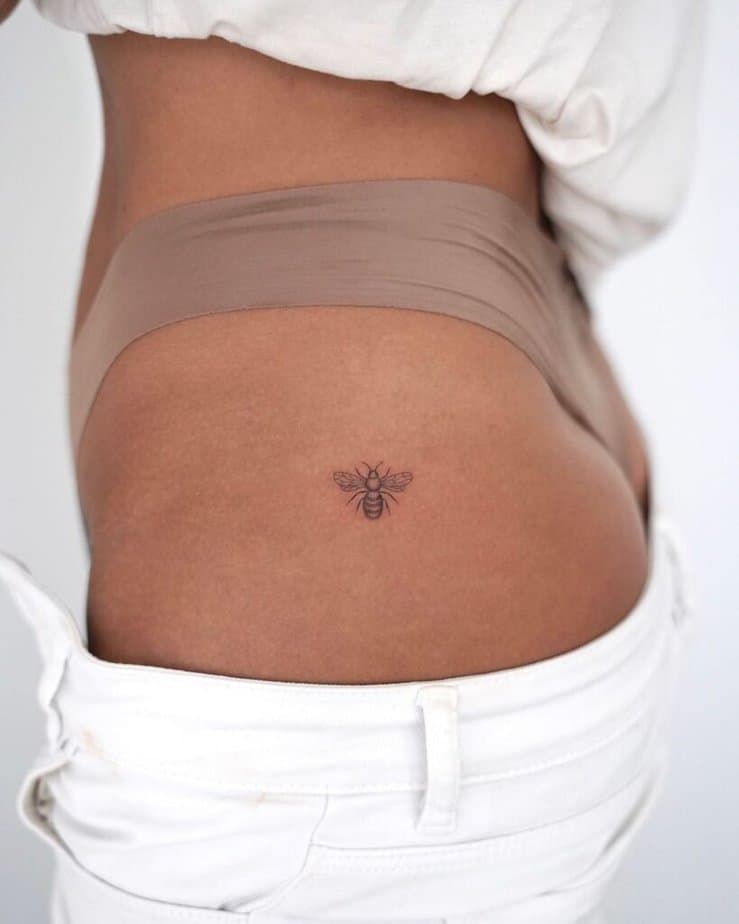 16. A bee tattoo on the hip 