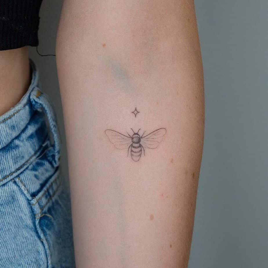 19. A hand-poked bee tattoo 