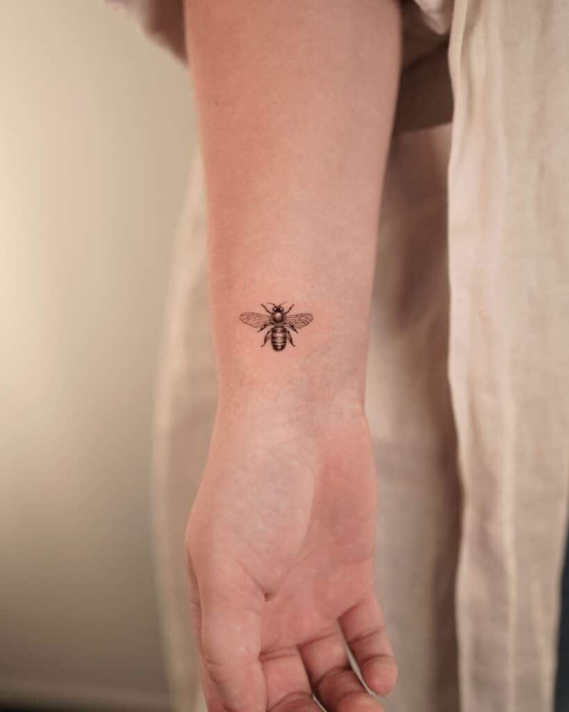 2. A tiny bee tattoo on the wrist