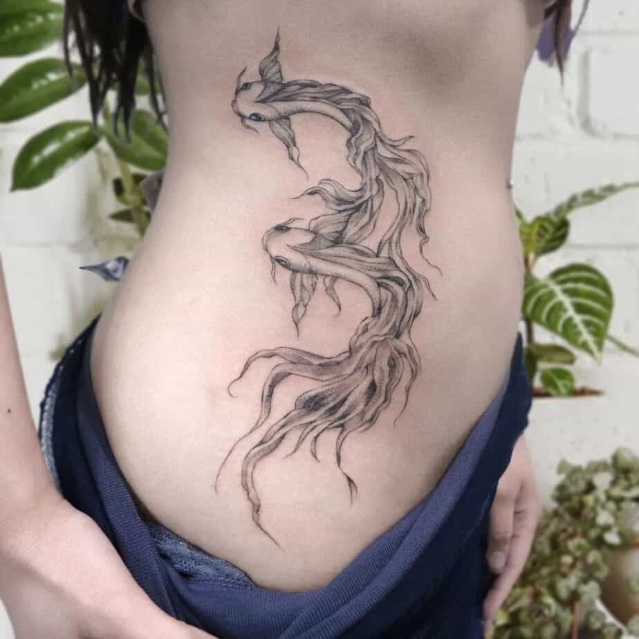 19. A fish tattoo on the side of the stomach