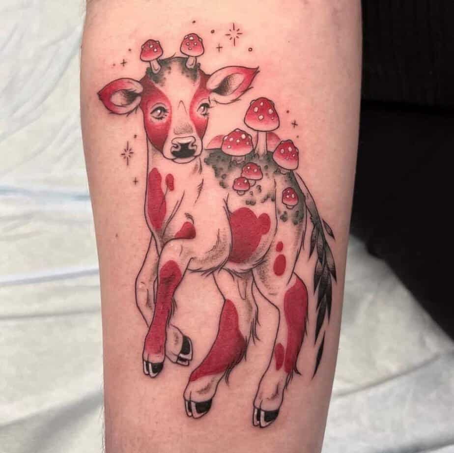 21. A mushroom cow tattoo