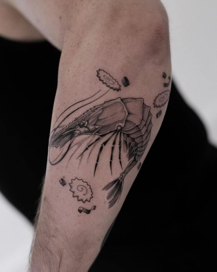 14. A tattoo of shrimp ingredients on the forearm