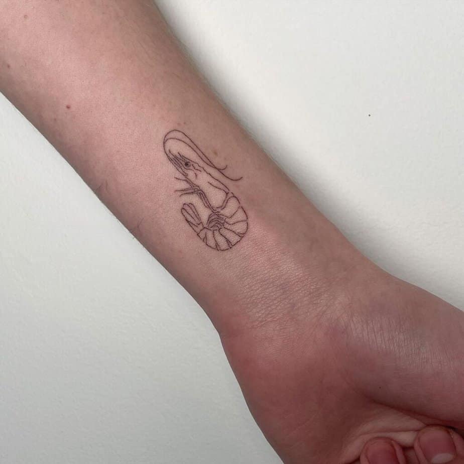 2. A simple shrimp tattoo on the wrist