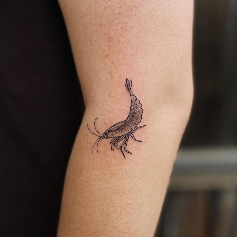 20. A subtle shrimp tattoo on the leg