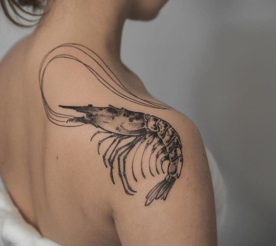 3. A statement shrimp tattoo on the shoulder and back 