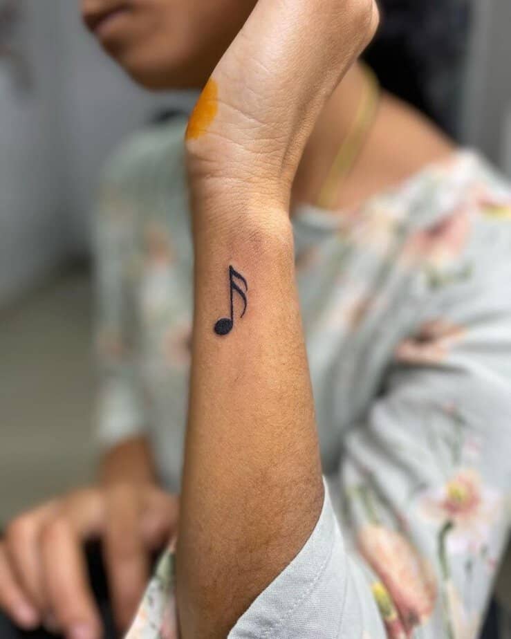 10. A musical note tattoo on the wrist