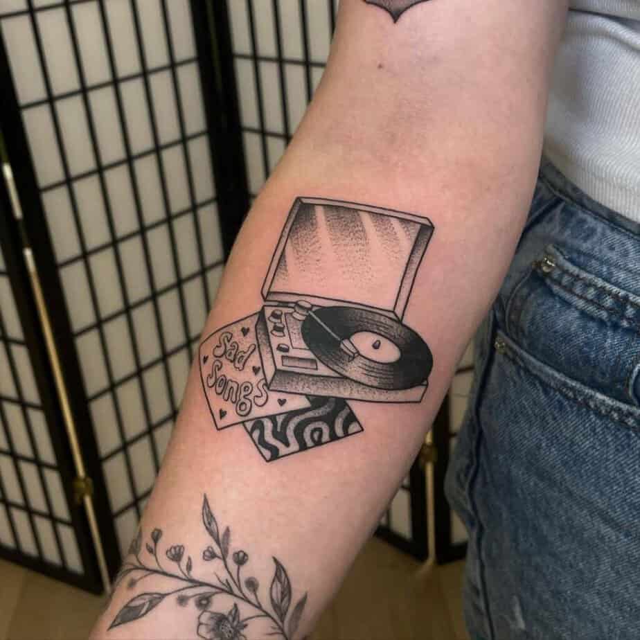 15. A gramophone tattoo on the forearm