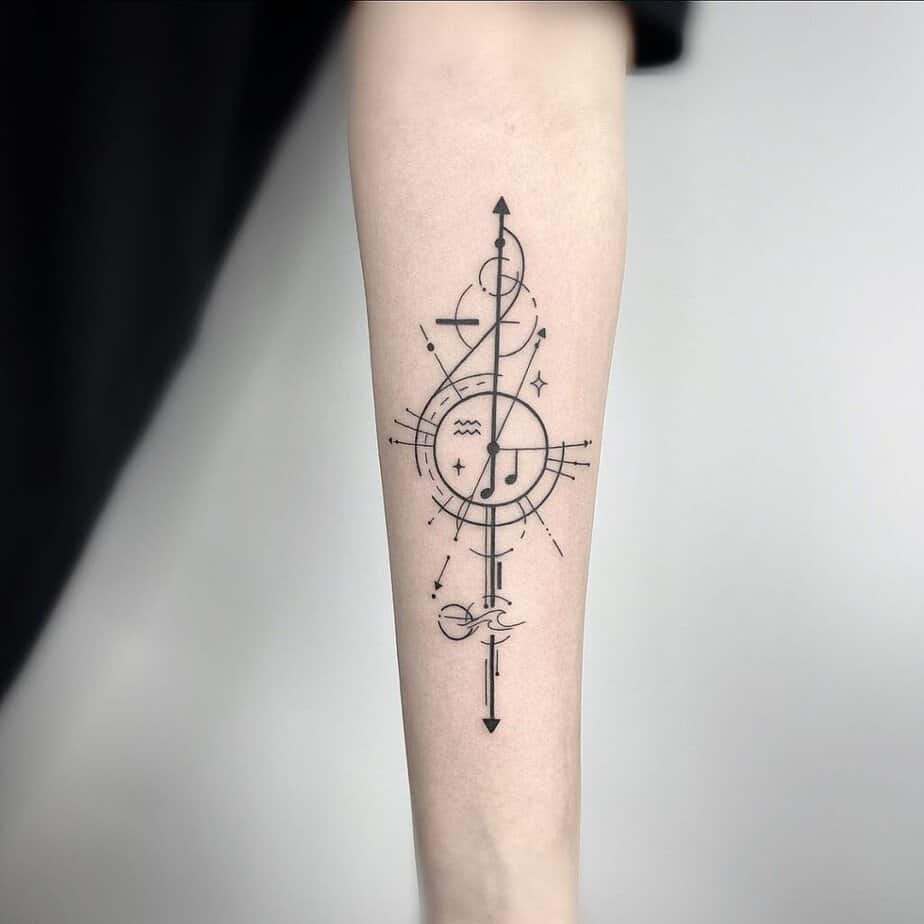 19. A geometric music tattoo on the forearm