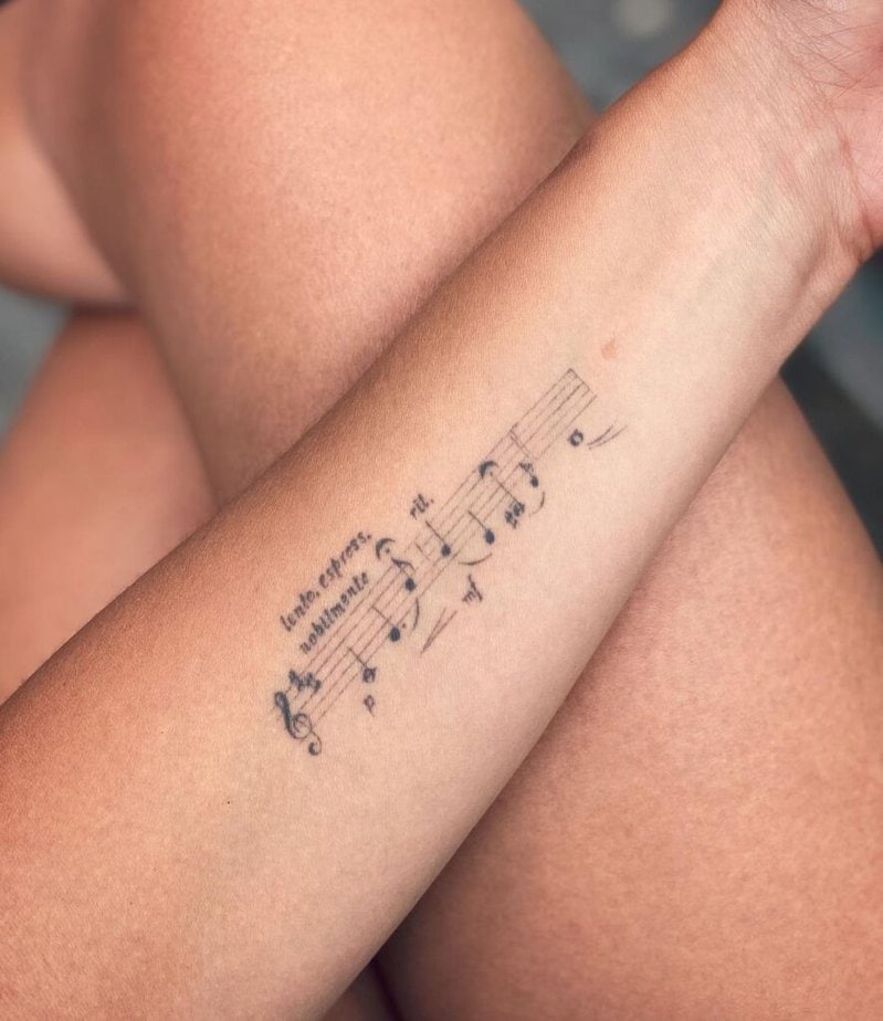 5. A music sheet tattoo on the inside of the arm