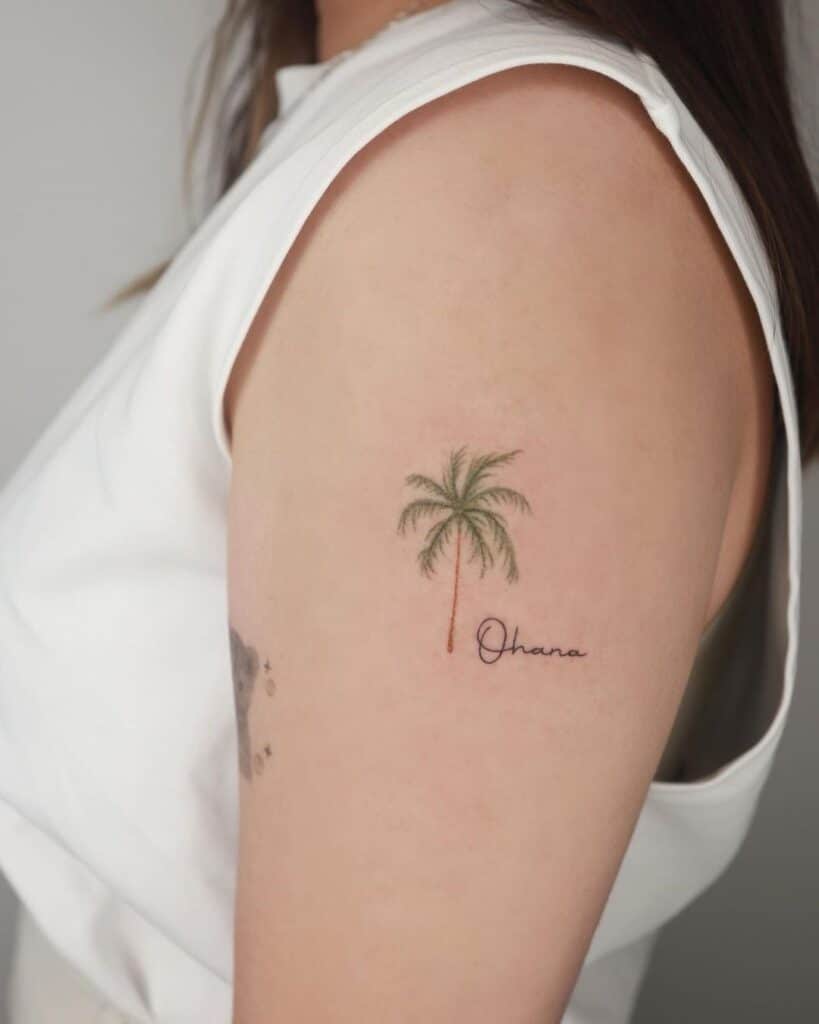 10. A colorful palm tree tattoo with a mantra