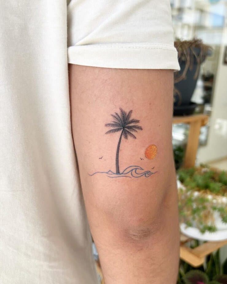 11. A colorful palm tree scene tattoo 