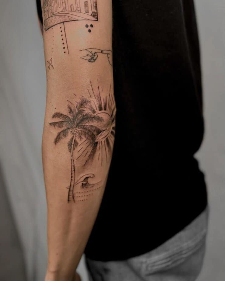 21. A palm tree tattoo sleeve