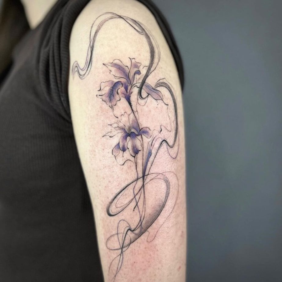 17. A smoke tattoo with a flower on the upper arm