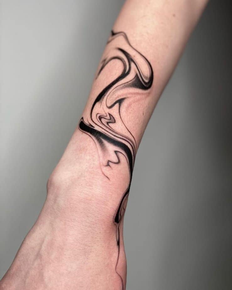 21. A simple smoke tattoo on the arm 