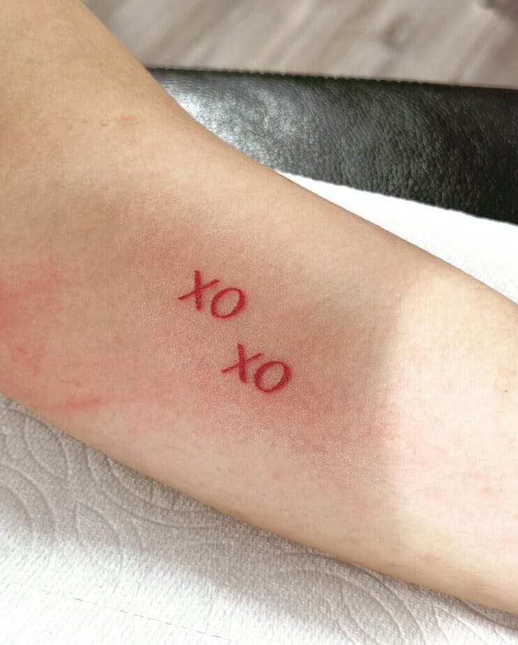 Matching XOXO tattoos