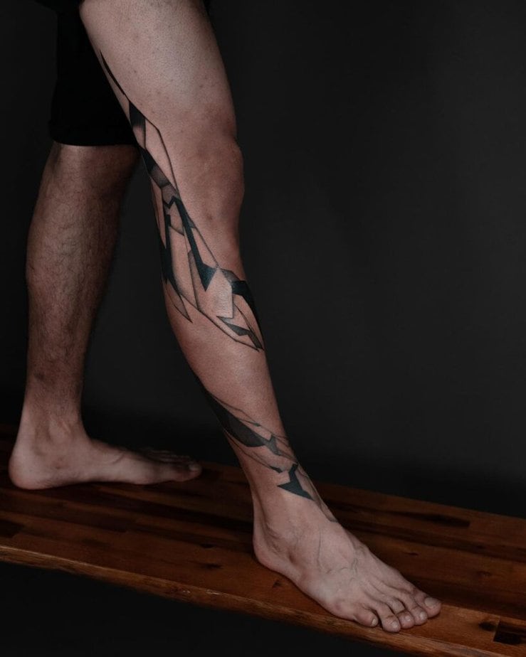 19. A geometric abstract tattoo on the leg
