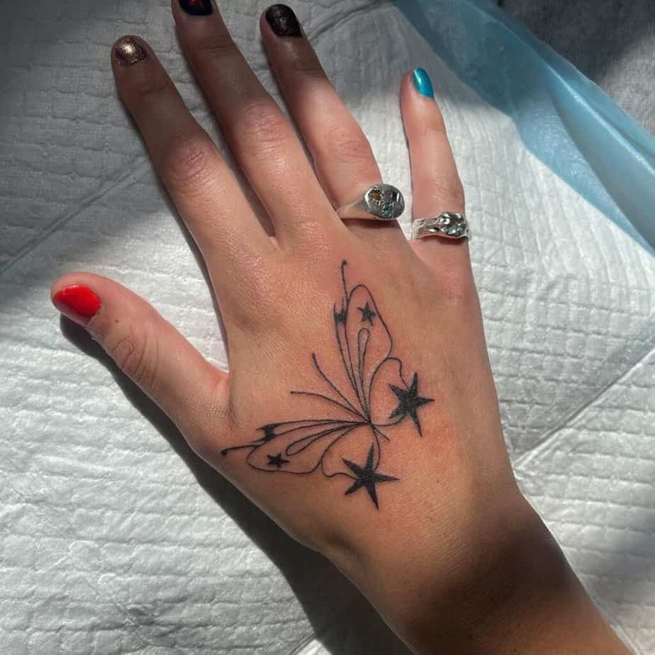 22. A dreamy butterfly hand tattoo 