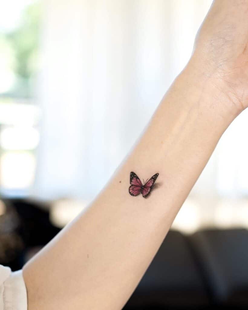 8. A butterfly tattoo on the back of the hand 