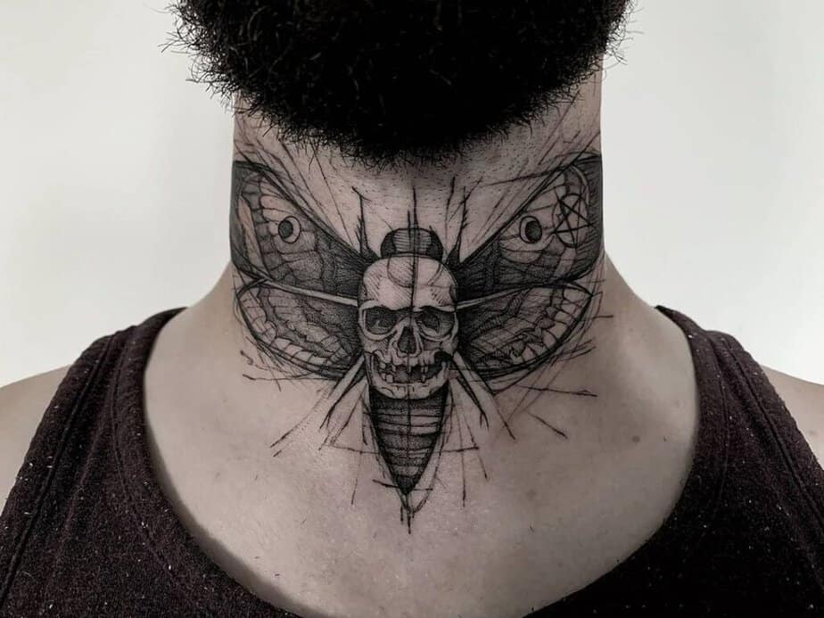 15. A scary butterfly neck tattoo with a skull 