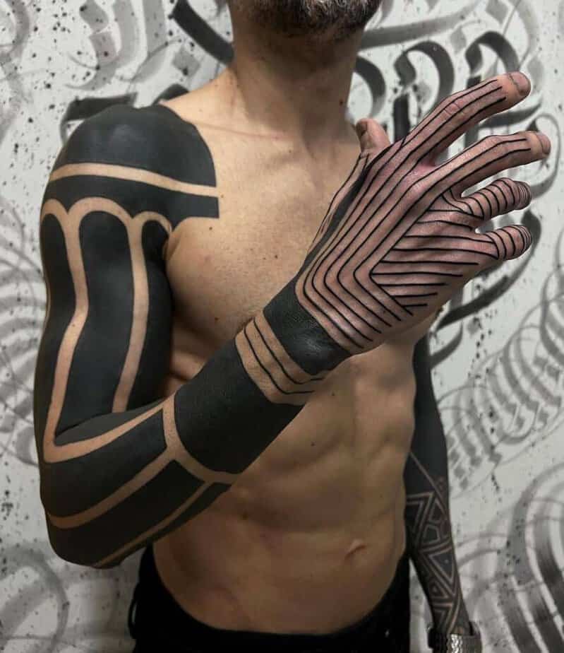 16. A black sleeve tattoo with linework 