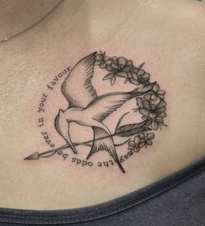 9. A Mockingjay tattoo on the chest 