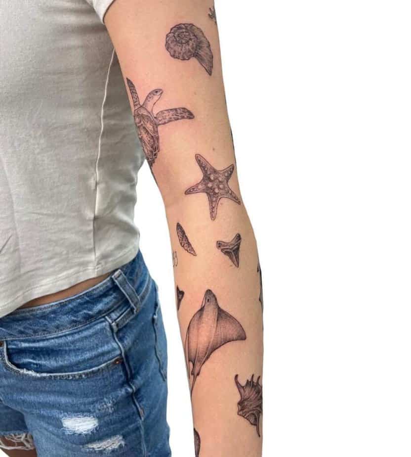 1. An ocean-themed sticker sleeve tattoo