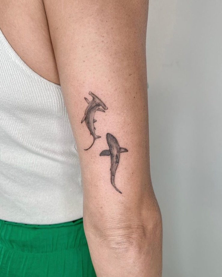 8. A tattoo of a hammerhead and a white shark 