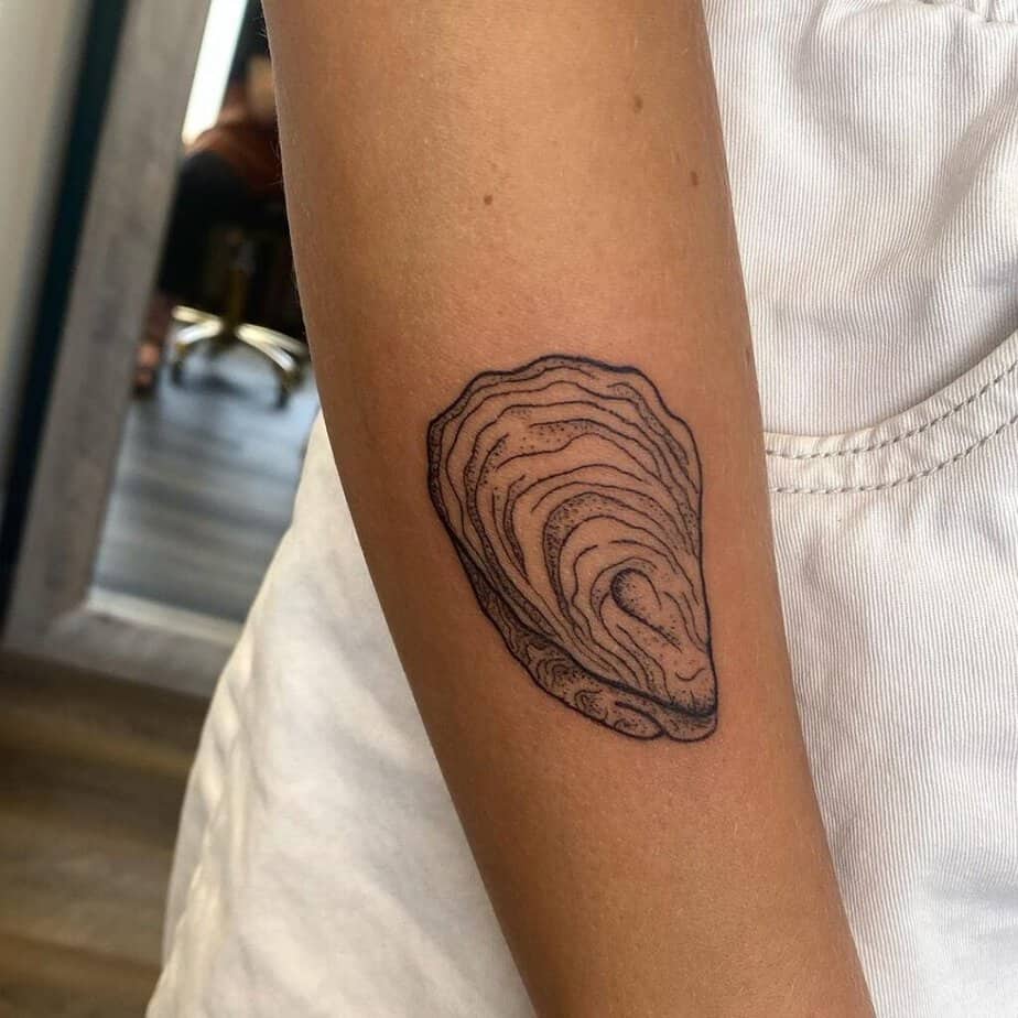 9. A tattoo of an oyster shell 