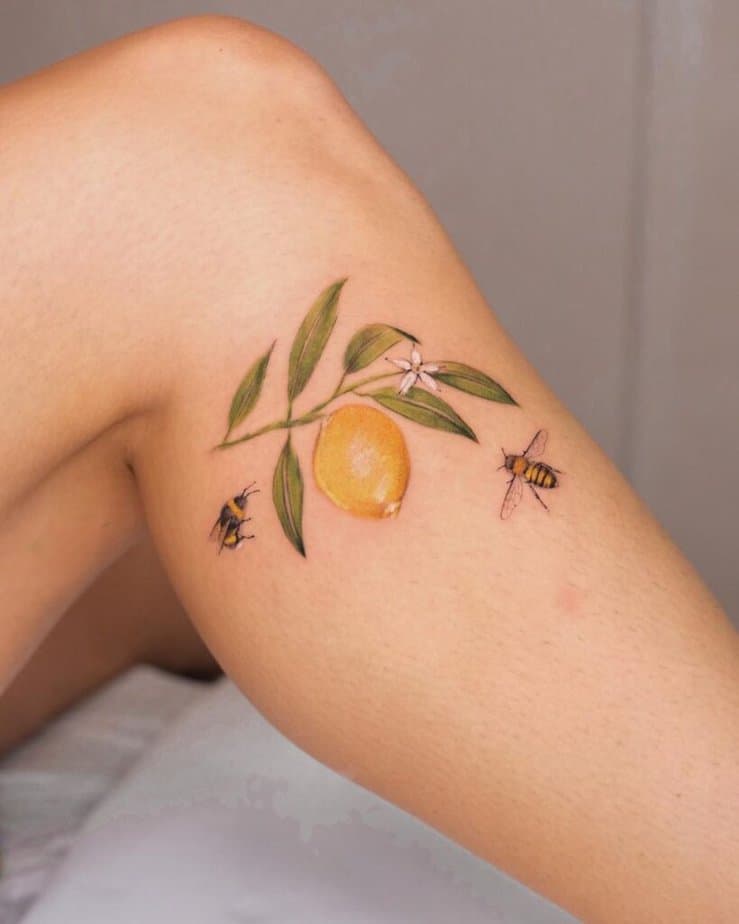 18. Tatuaggio di un limone sulla gamba