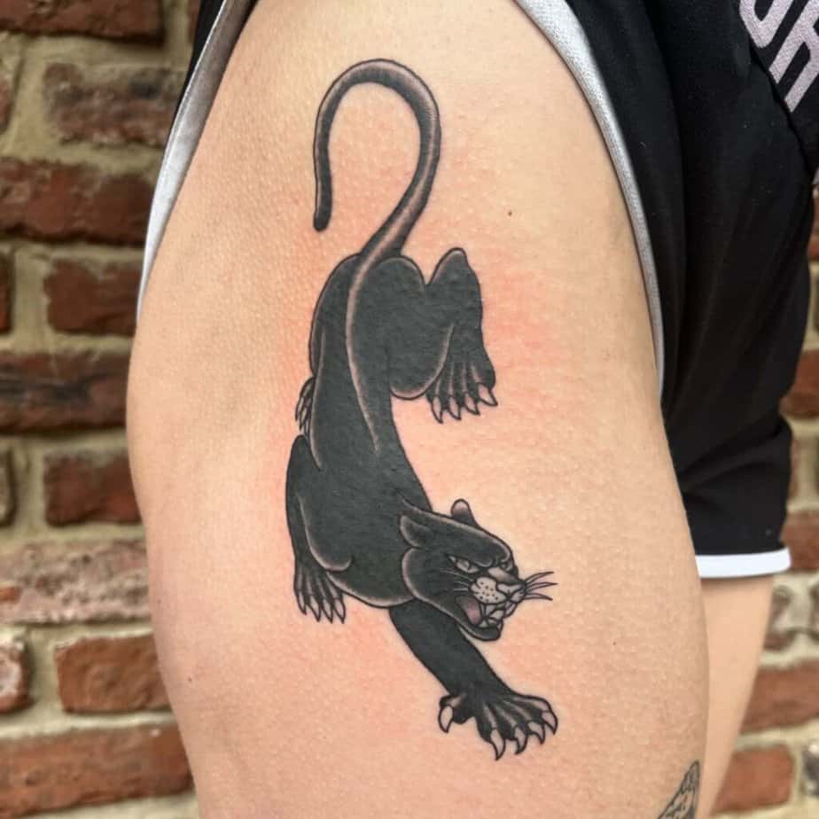 15. A black panther tattoo on the hip