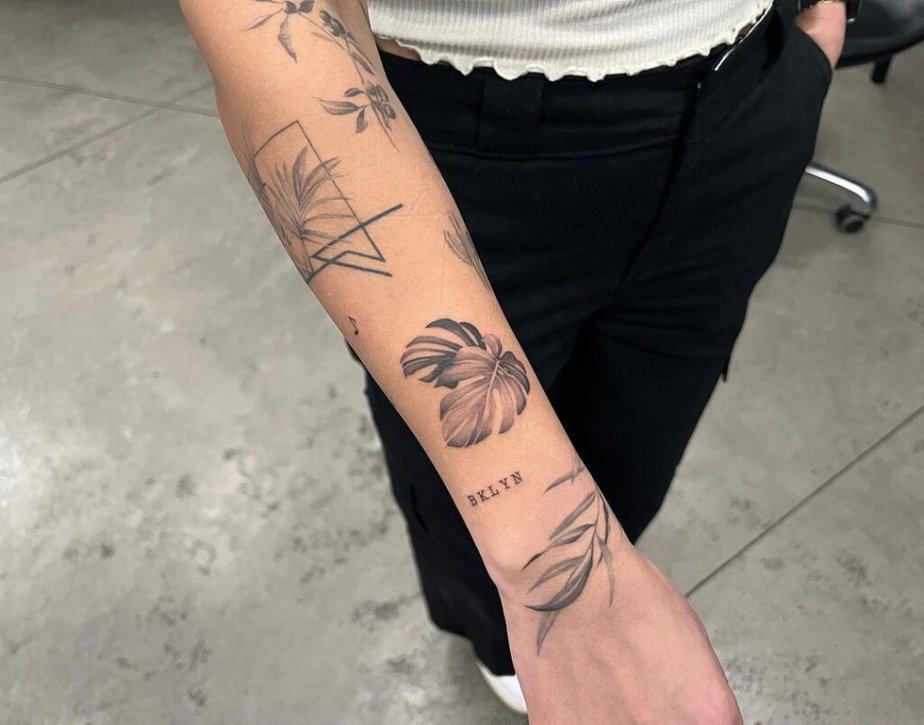 19. A botanical patchwork tattoo sleeve 