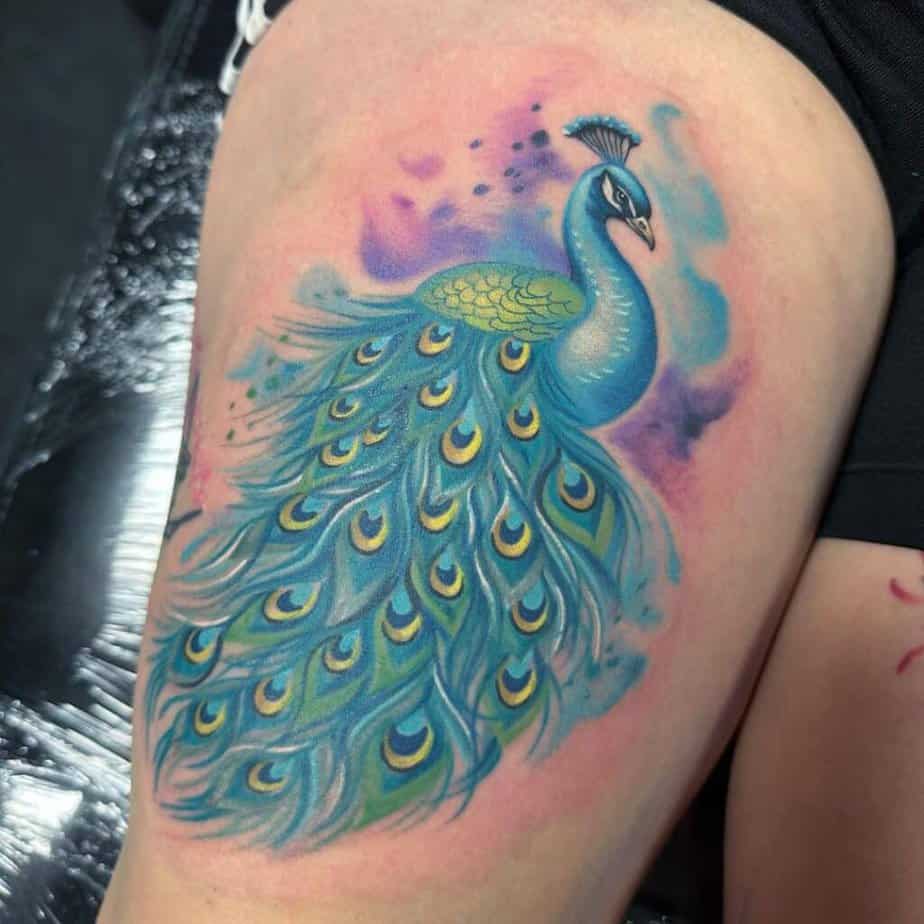 2. Watercolor peacock tattoo