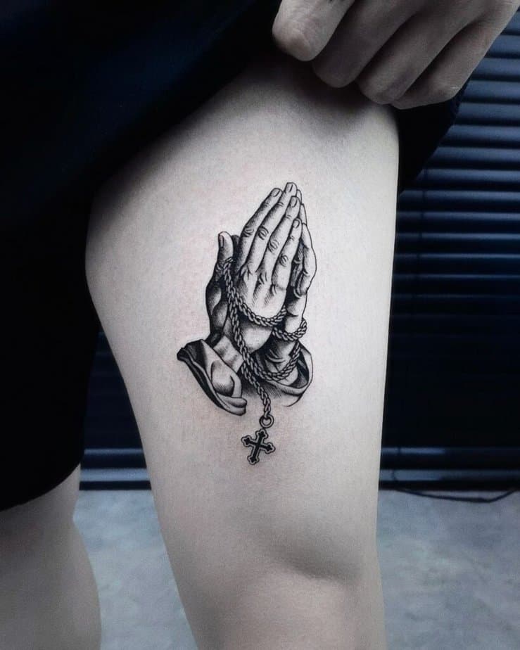 19. Praying hands tattoo