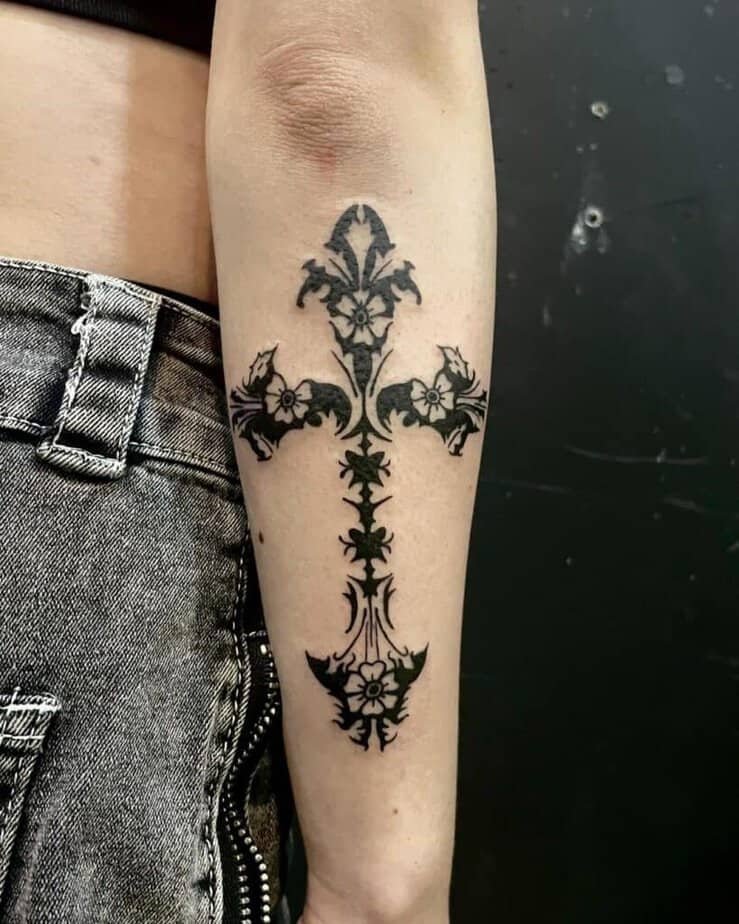 22. Floral cross tattoo