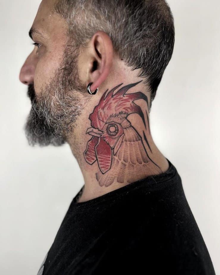 17. A rooster tattoo on the neck