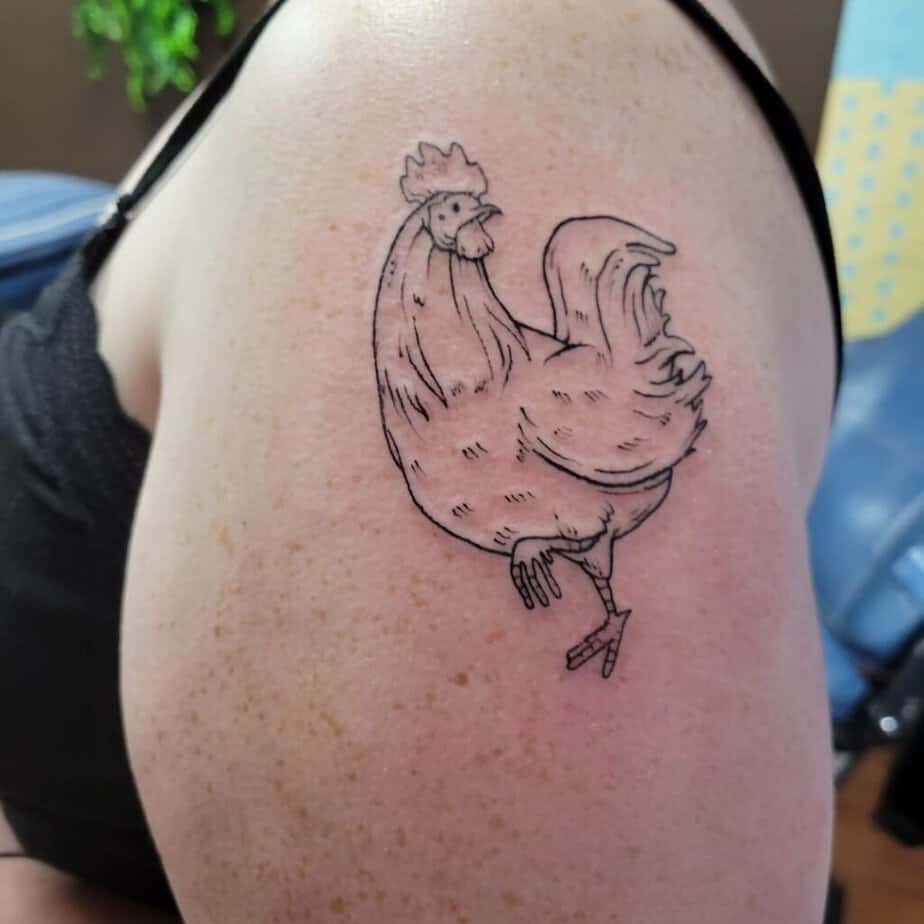 18. A line art rooster tattoo 