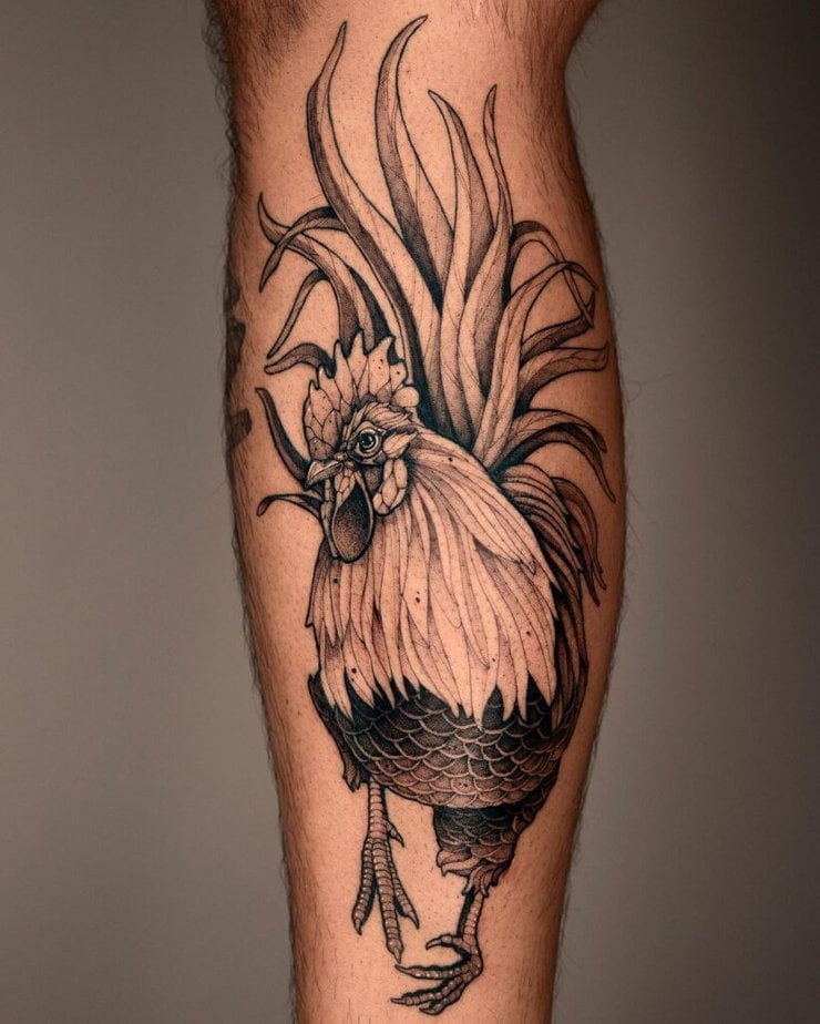 4. A rooster tattoo on the leg