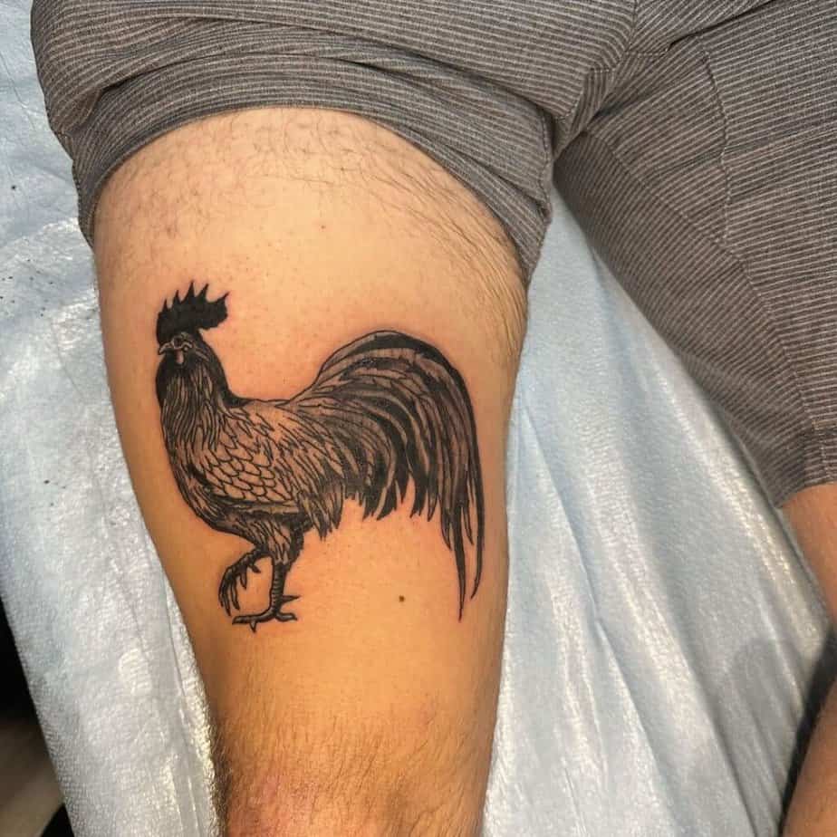 8. A rooster tattoo on the thigh 