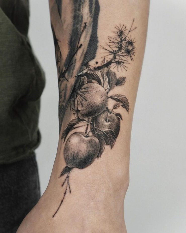 14. A black apple tree tattoo 