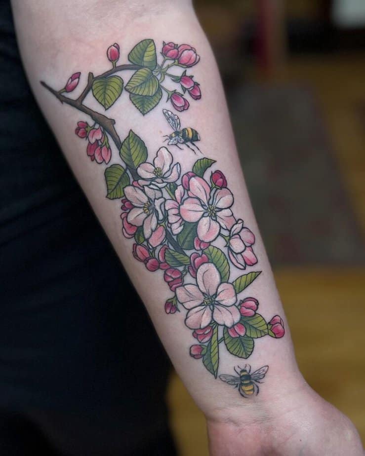 22. An apple tree tattoo with bees