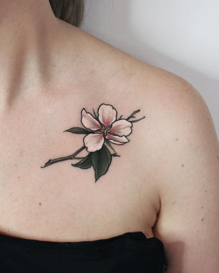 3. An apple tree blossom tattoo on the collarbone